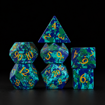 Abyssal Mosaic Gate-Gemstone Dice Set – standing polyhedral set on black leather