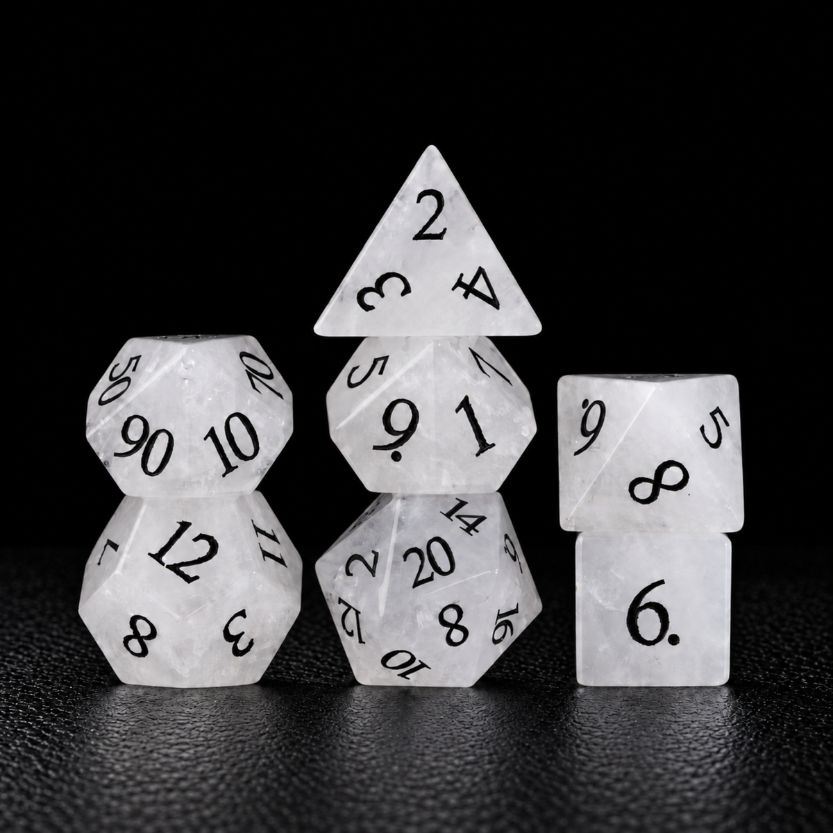 Frostbound Prophecy-Gemstone Dice Set – standing polyhedral set on black leather
